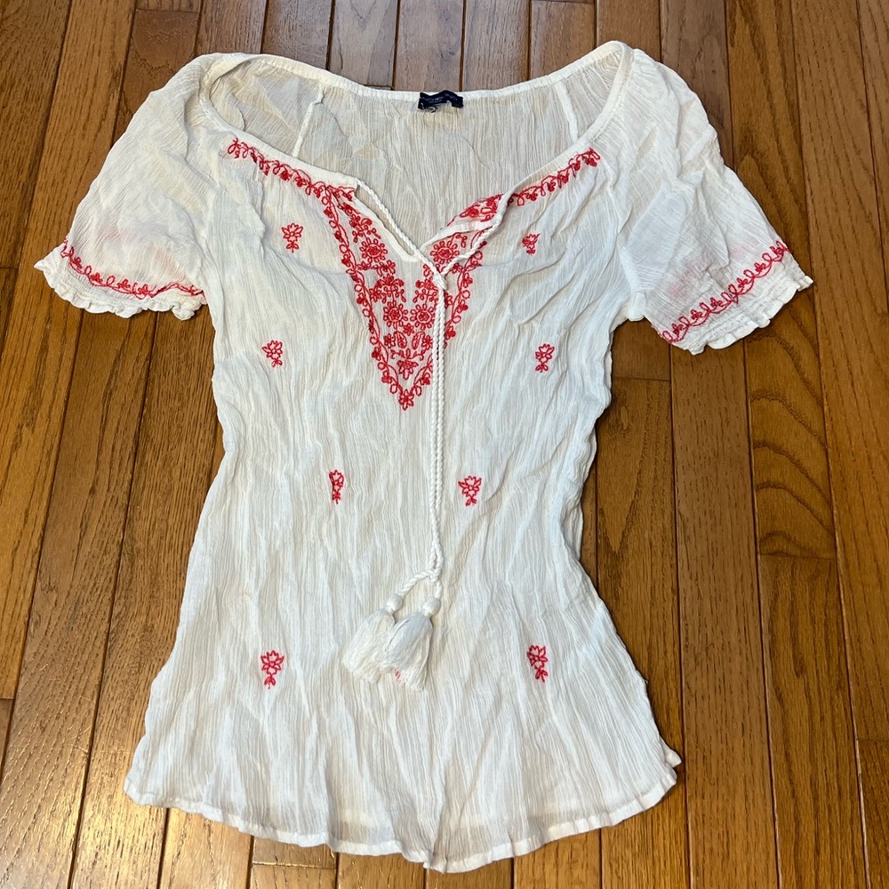 Women’s white shirt with red embroidery